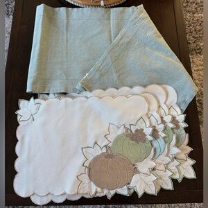 pumpkin-themed placemats and a matching table runner